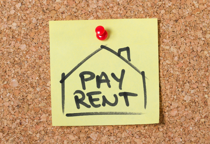A graphic saying "Pay Rent".